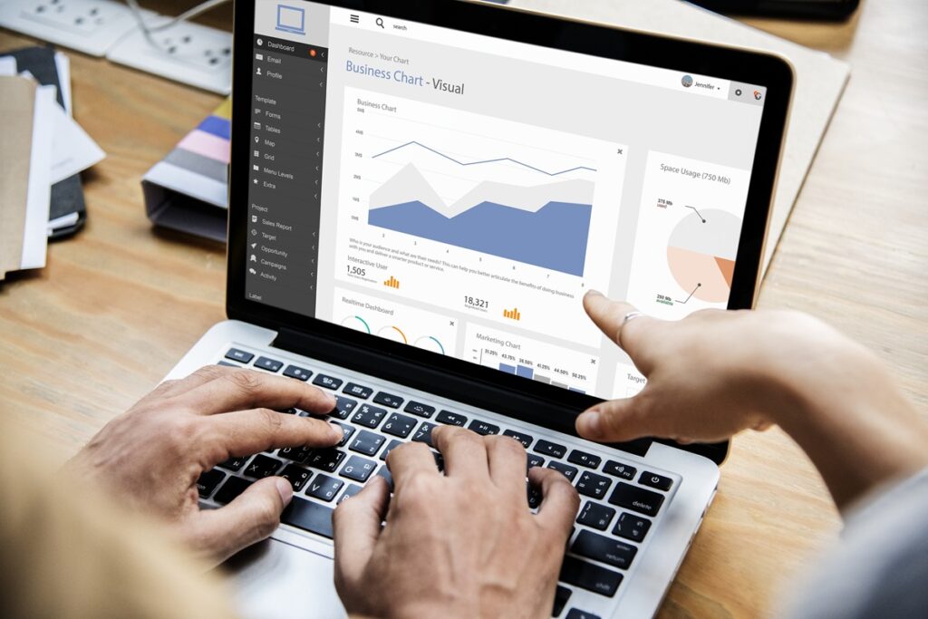 A person looking at a rising chart or dashboard