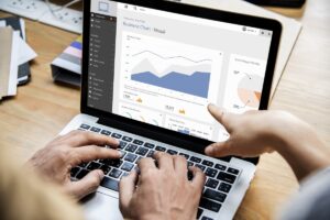 A person looking at a rising chart or dashboard
